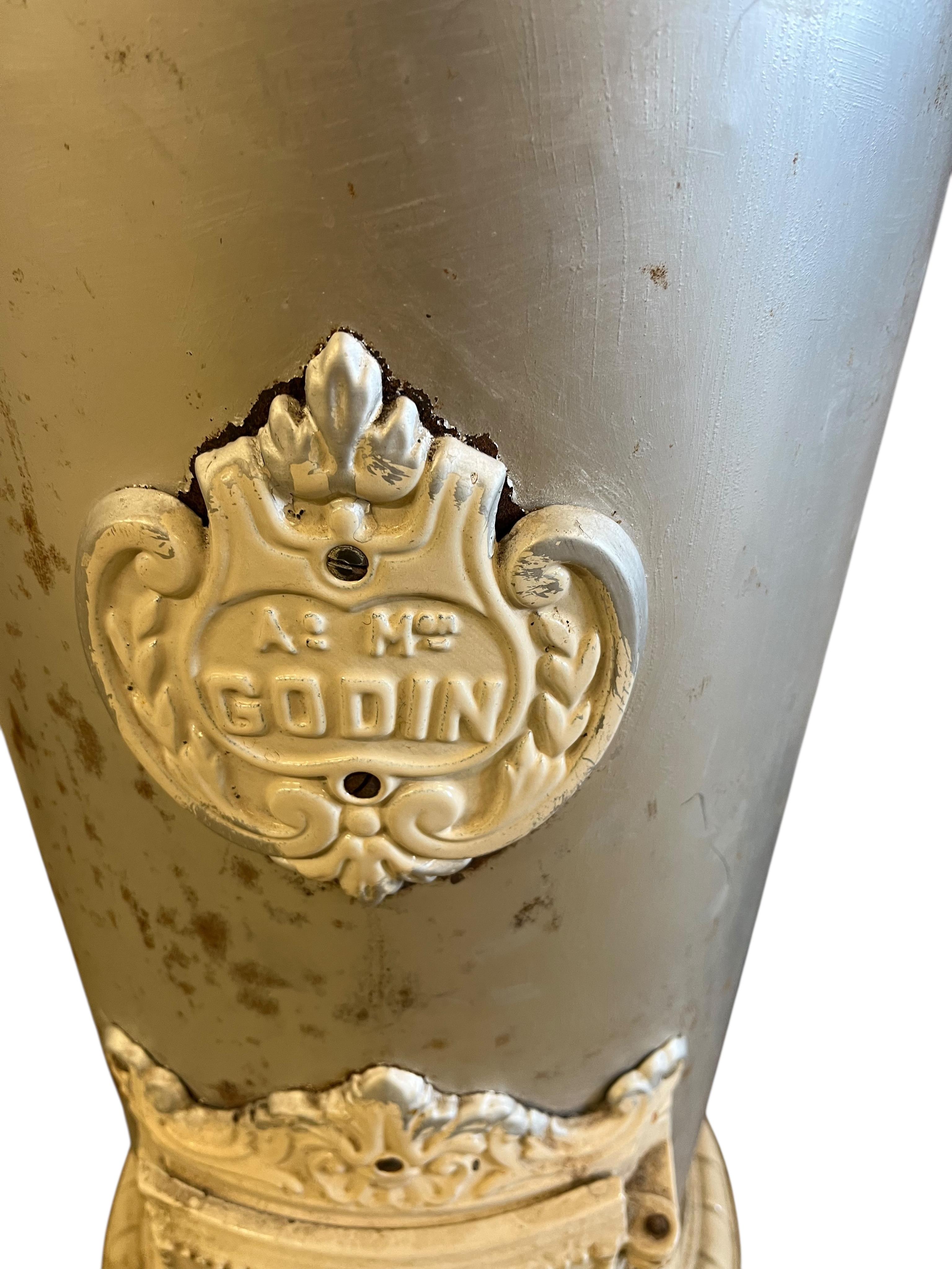 A 19th century French Godin cast iron stove, height 96cm